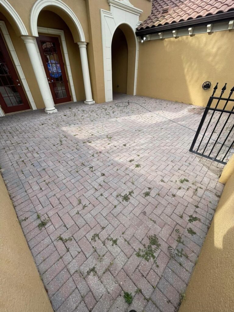 Faded pavers before color restoration