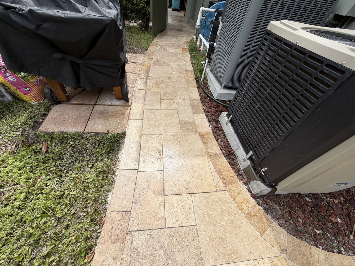 A cleaned and sealed travertine outdoor surface